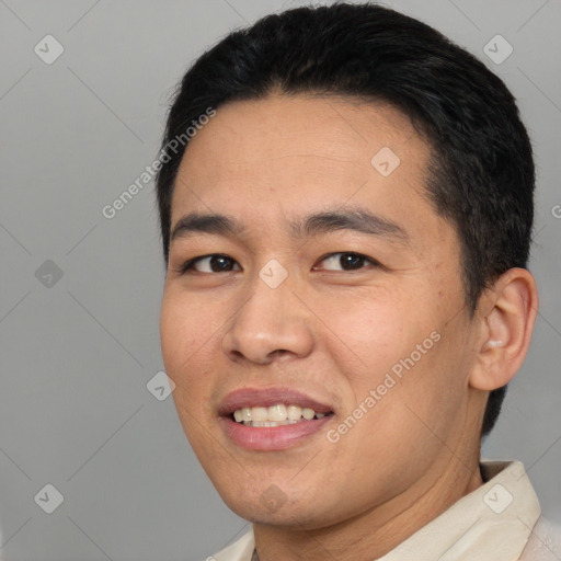 Joyful asian young-adult male with short  black hair and brown eyes