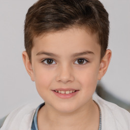 Joyful white child male with short  brown hair and brown eyes