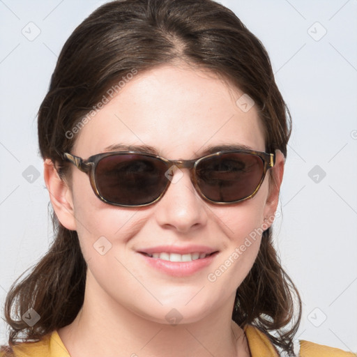 Joyful white young-adult female with medium  brown hair and blue eyes
