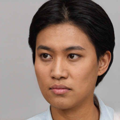 Neutral asian young-adult female with short  brown hair and brown eyes