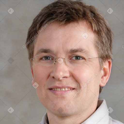 Joyful white adult male with short  brown hair and grey eyes