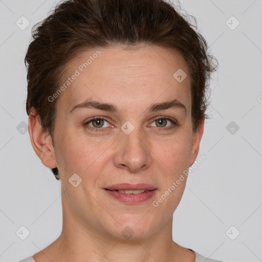 Joyful white adult female with short  brown hair and grey eyes