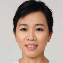 Joyful asian young-adult female with short  black hair and brown eyes