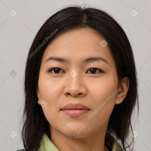 Joyful latino adult female with medium  brown hair and brown eyes