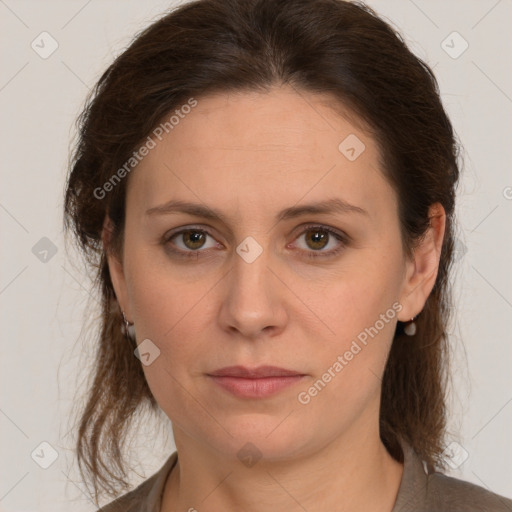 Joyful white young-adult female with medium  brown hair and green eyes