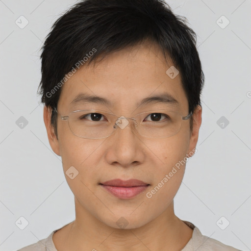 Joyful asian young-adult male with short  brown hair and brown eyes