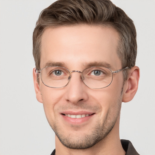 Joyful white adult male with short  brown hair and grey eyes