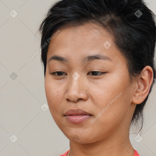 Joyful asian young-adult female with short  brown hair and brown eyes