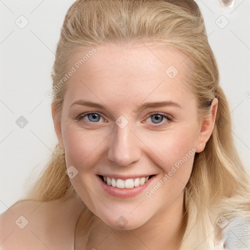 Joyful white young-adult female with long  brown hair and blue eyes