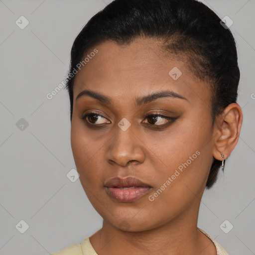 Joyful latino young-adult female with short  brown hair and brown eyes