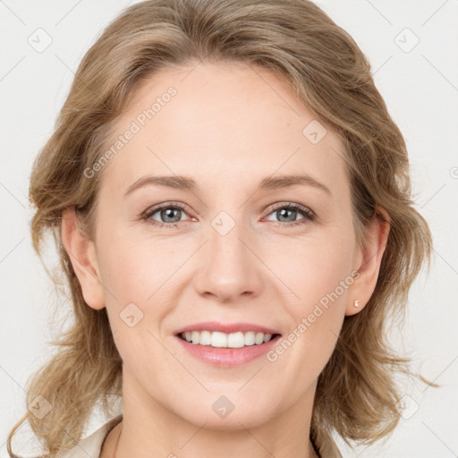 Joyful white young-adult female with medium  brown hair and blue eyes