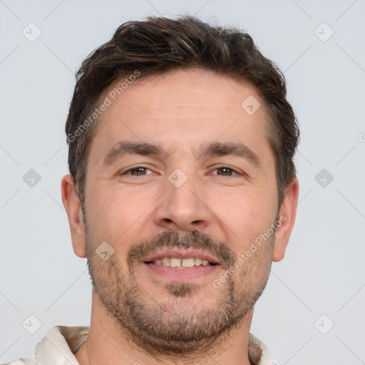 Joyful white adult male with short  brown hair and brown eyes