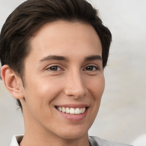 Joyful white young-adult female with short  brown hair and brown eyes