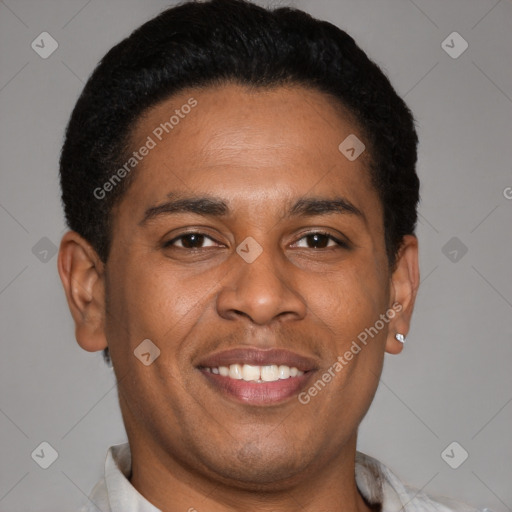 Joyful latino young-adult male with short  brown hair and brown eyes