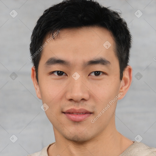 Joyful asian young-adult male with short  black hair and brown eyes