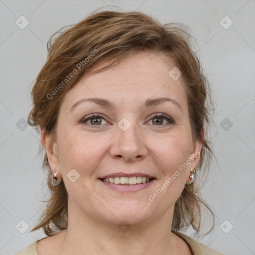 Joyful white adult female with medium  brown hair and grey eyes