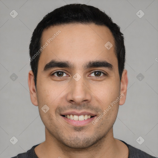 Joyful white young-adult male with short  black hair and brown eyes