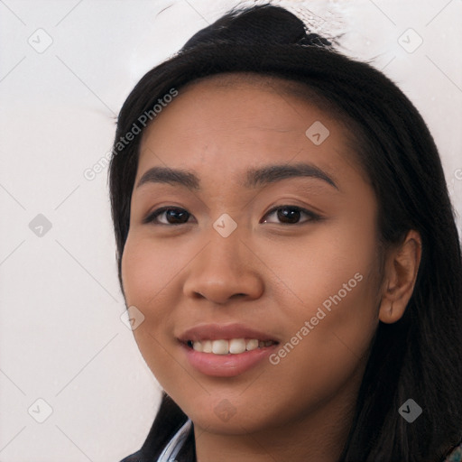 Joyful latino young-adult female with long  black hair and brown eyes