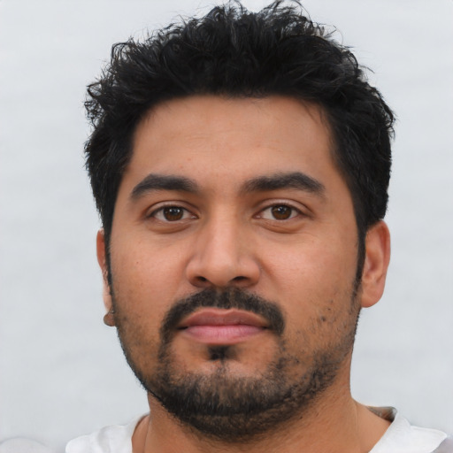 Neutral latino young-adult male with short  black hair and brown eyes