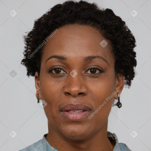 Joyful black adult female with short  brown hair and brown eyes