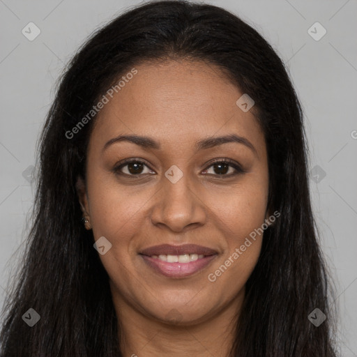 Joyful black young-adult female with long  brown hair and brown eyes