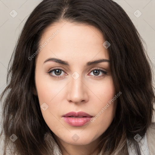 Neutral white young-adult female with long  brown hair and brown eyes