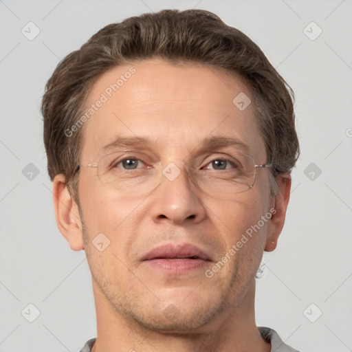 Joyful white adult male with short  brown hair and grey eyes