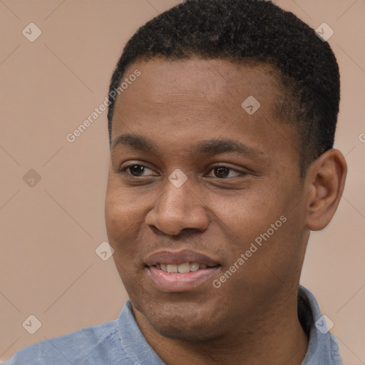 Joyful black young-adult male with short  black hair and brown eyes