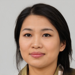 Joyful asian young-adult female with medium  black hair and brown eyes