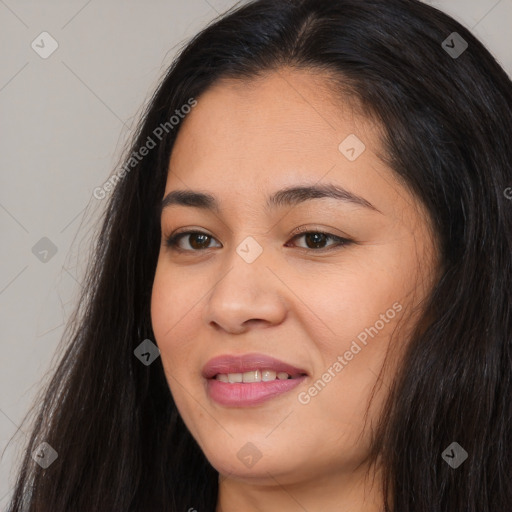 Joyful asian young-adult female with long  black hair and brown eyes