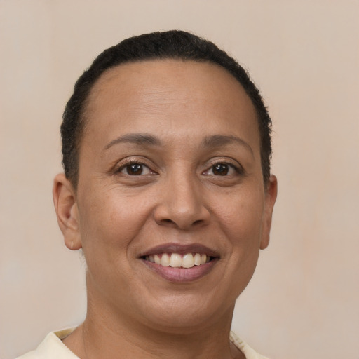 Joyful white adult female with short  brown hair and brown eyes