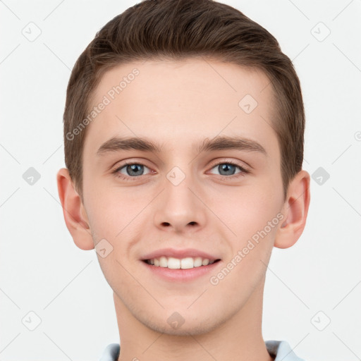 Joyful white young-adult male with short  brown hair and grey eyes