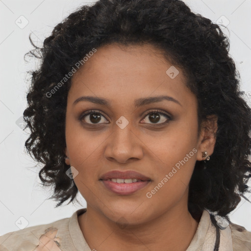 Joyful black young-adult female with long  brown hair and brown eyes