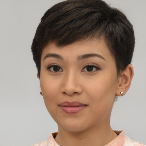 Joyful asian young-adult female with short  brown hair and brown eyes