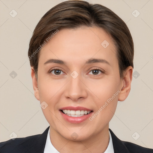 Joyful white young-adult female with short  brown hair and brown eyes