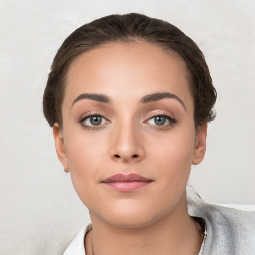 Neutral white young-adult female with short  brown hair and brown eyes