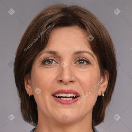 Joyful white adult female with medium  brown hair and grey eyes