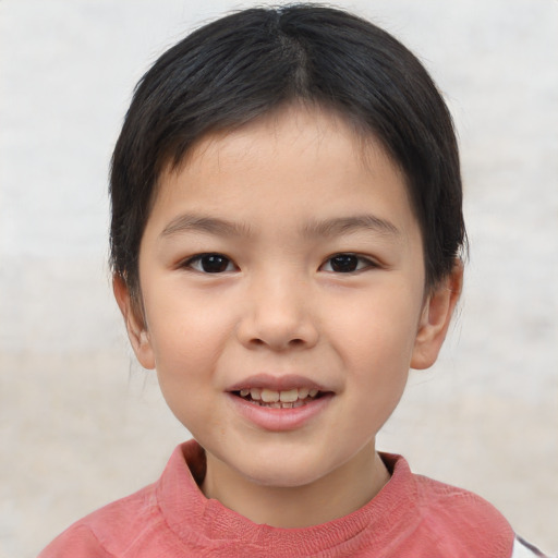 Joyful asian child female with short  brown hair and brown eyes