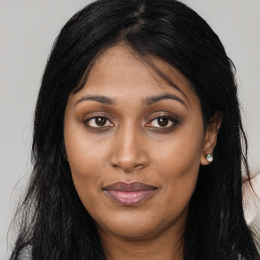 Joyful asian young-adult female with long  brown hair and brown eyes