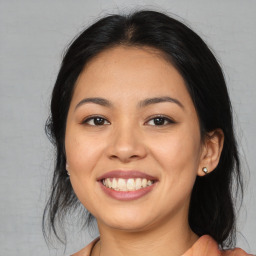 Joyful asian young-adult female with medium  black hair and brown eyes