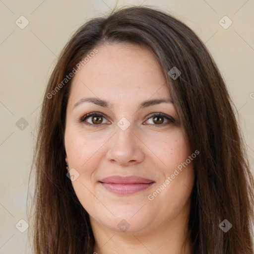 Joyful white adult female with long  brown hair and brown eyes