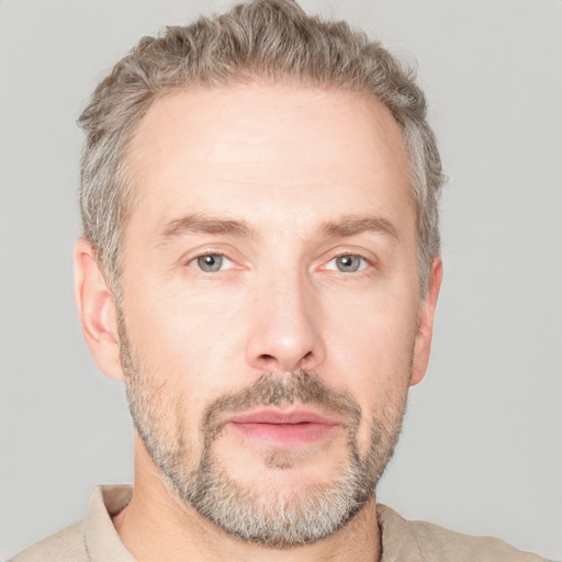 Neutral white adult male with short  brown hair and grey eyes