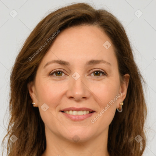 Joyful white adult female with long  brown hair and green eyes