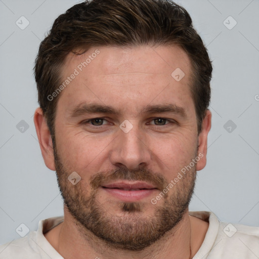 Joyful white adult male with short  brown hair and grey eyes