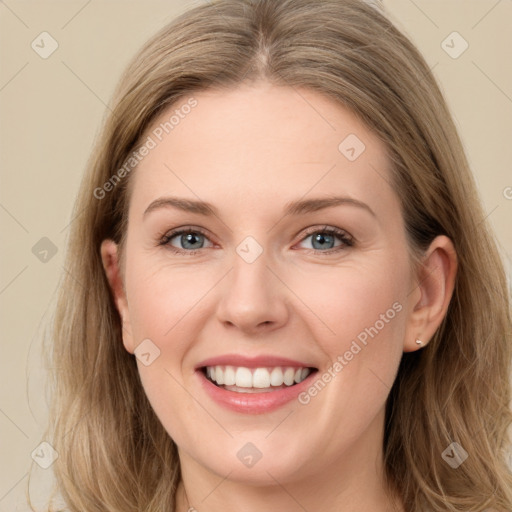 Joyful white young-adult female with long  brown hair and green eyes