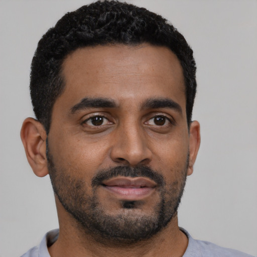 Neutral black young-adult male with short  black hair and brown eyes