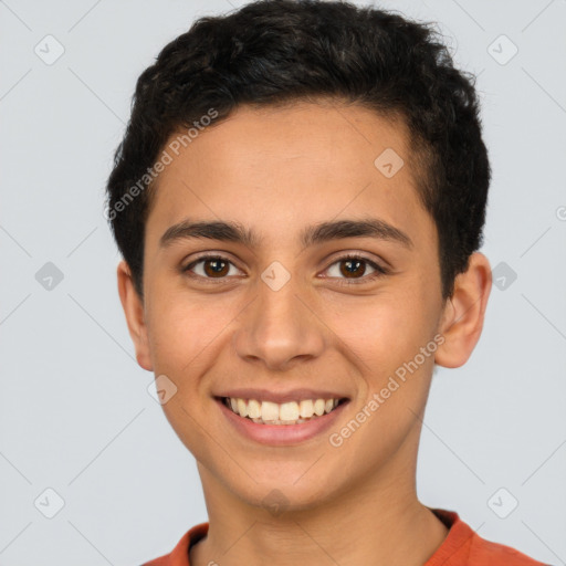 Joyful latino young-adult male with short  brown hair and brown eyes