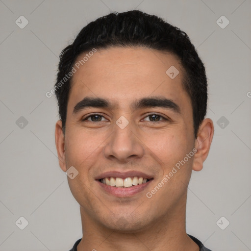 Joyful latino young-adult male with short  black hair and brown eyes