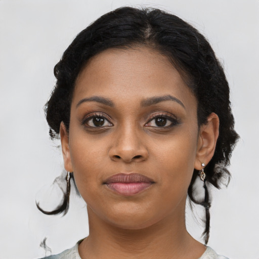 Joyful latino young-adult female with medium  black hair and brown eyes