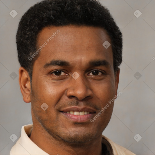 Joyful black young-adult male with short  brown hair and brown eyes